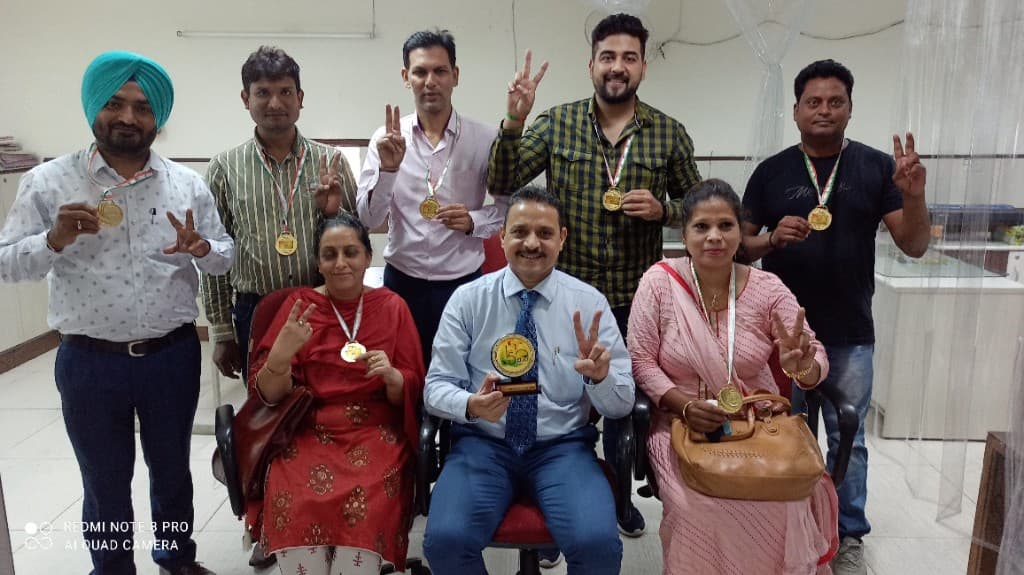 Team recognition with medals and celebration